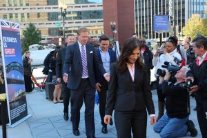 Officials from British Embassy and D.C. Department of Transportation and other dignitaries walk across new “smart tiles” in Dupont Circle in Washington. (Courtesy of the British Embassy) 